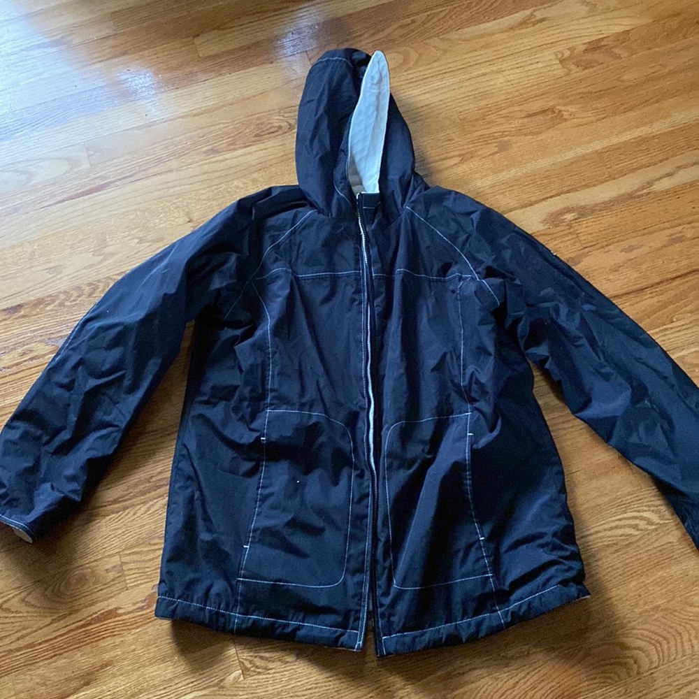 Black Izod coat with cozy fluffy interior, size medium. Good for cold/rainy day.